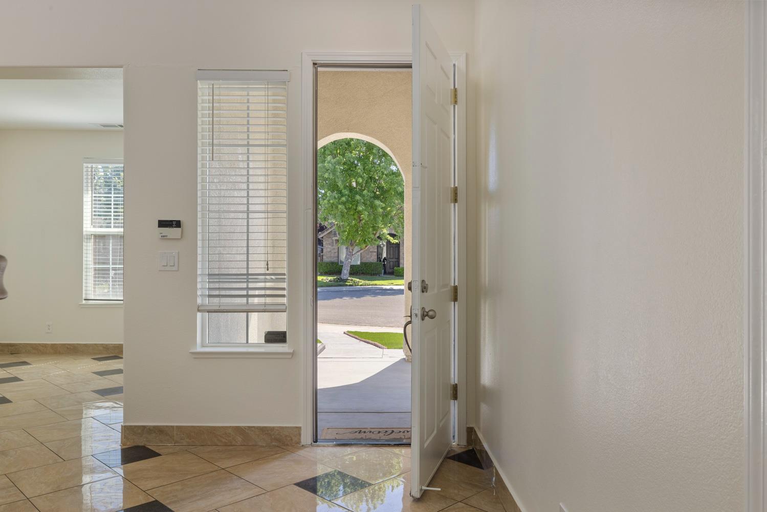 3105 Ripple Court Modesto, CA 95355 - Photo 5 of 46 a view of an entryway with wooden floor