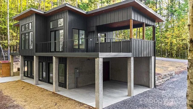 a view of a house with a yard and porch