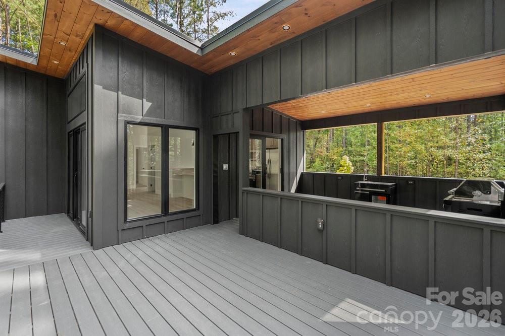 203 Golden Crk Ridge Union Mills, NC 28167 - Photo 13 of 47 a view of a two room with wooden floor and outdoor space