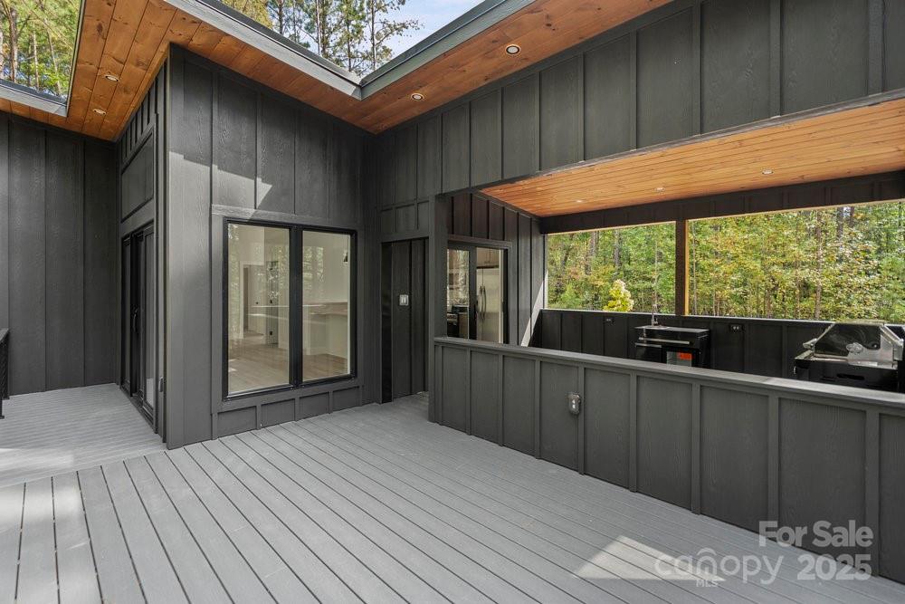 203 Golden Crk Ridge Union Mills, NC 28167 - Photo 13 of 47 a view of a two room with wooden floor and outdoor space