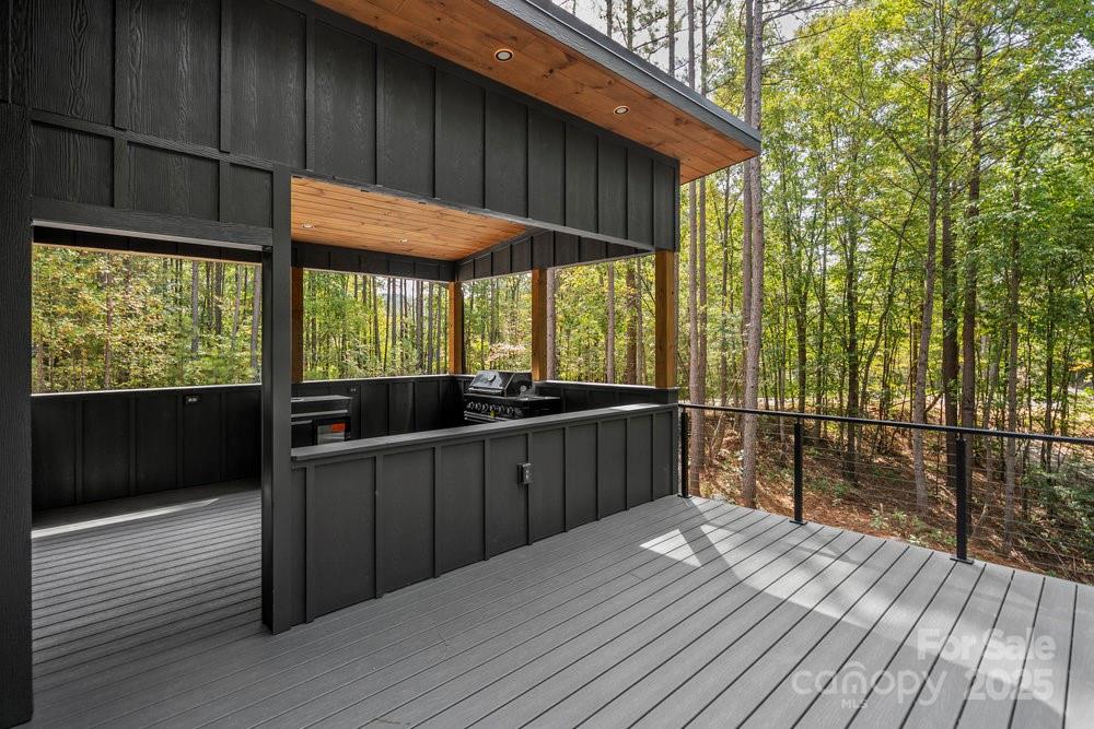 203 Golden Crk Ridge Union Mills, NC 28167 - Photo 14 of 47 a view of a balcony with wooden floor and iron stairs