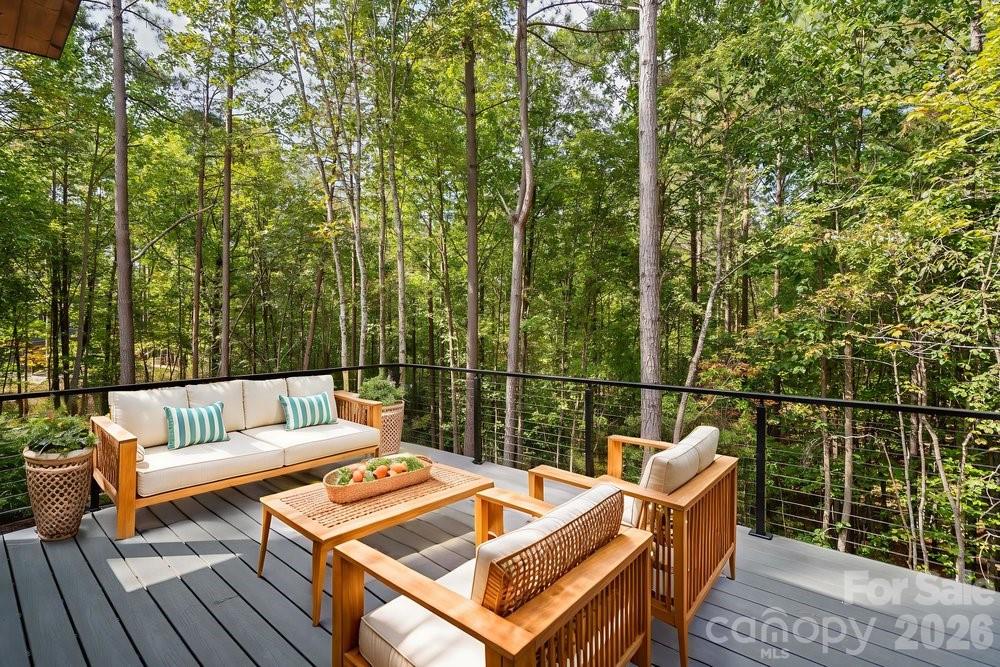 203 Golden Crk Ridge Union Mills, NC 28167 - Photo 16 of 47 a roof deck with couches and wooden floor