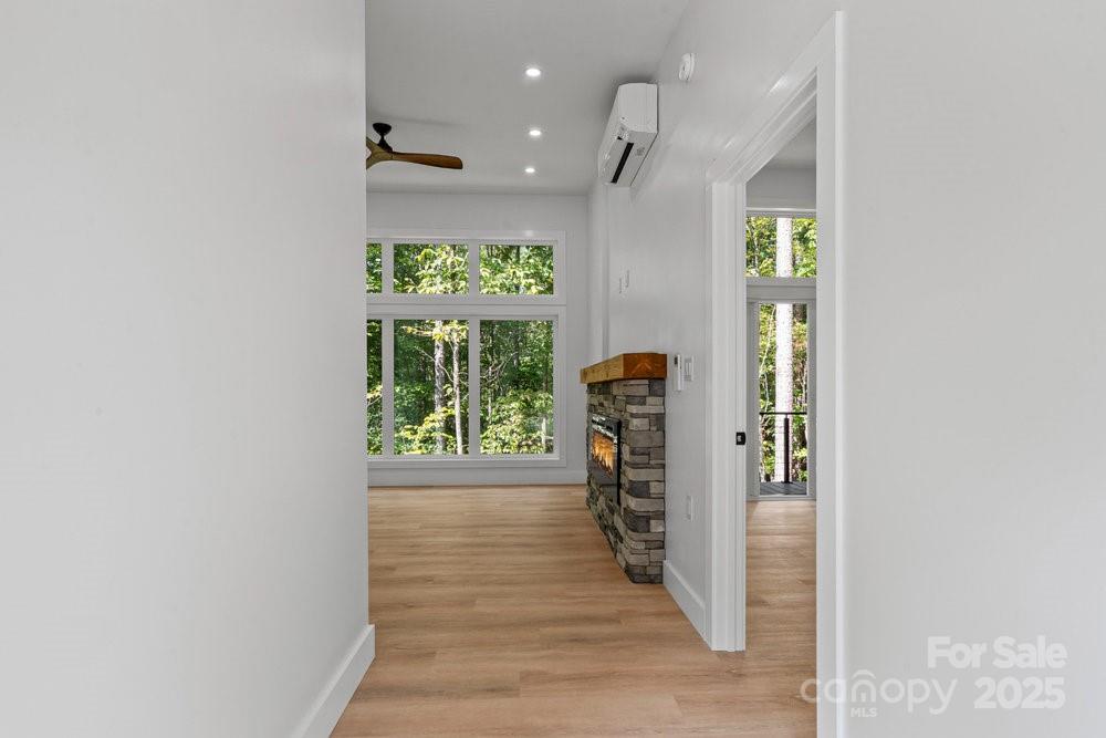 203 Golden Crk Ridge Union Mills, NC 28167 - Photo 19 of 47 an empty room with wooden floor and a window