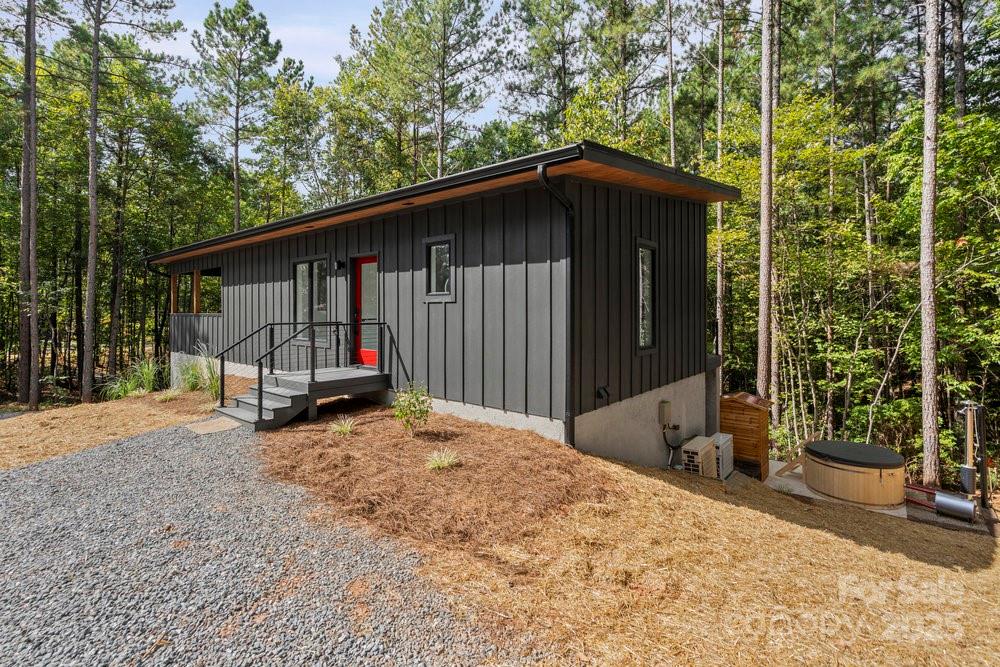 203 Golden Crk Ridge Union Mills, NC 28167 - Photo 2 of 47 a view of a house with backyard and trees