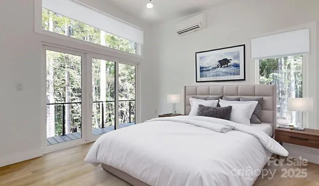 a view of an empty room with a fireplace and a window