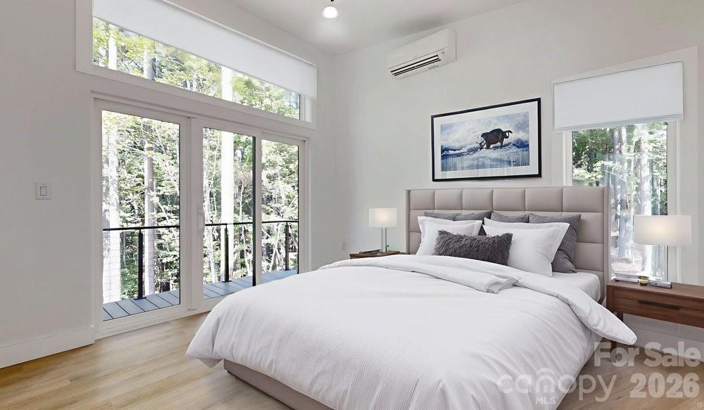 203 Golden Crk Ridge Union Mills, NC 28167 - Photo 21 of 47 a bedroom with a large bed and a large window