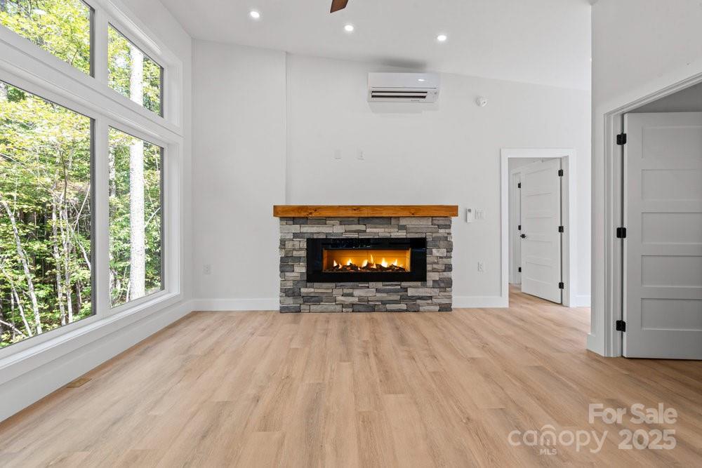 203 Golden Crk Ridge Union Mills, NC 28167 - Photo 22 of 47 a view of an empty room with a fireplace and a window