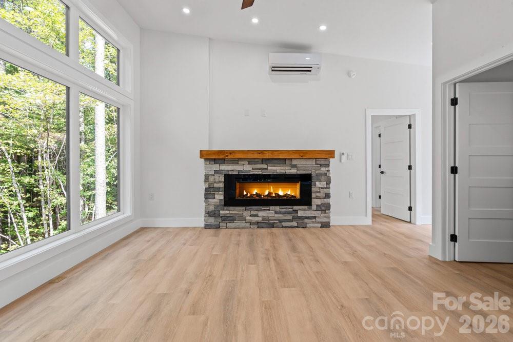 203 Golden Crk Ridge Union Mills, NC 28167 - Photo 22 of 47 a view of an empty room with a fireplace and a window