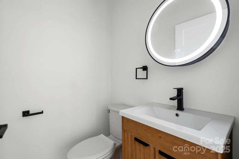 203 Golden Crk Ridge Union Mills, NC 28167 - Photo 26 of 47 a bathroom with a sink and a mirror
