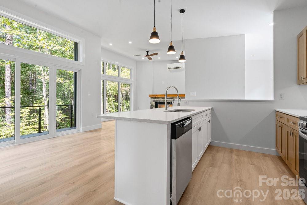 203 Golden Crk Ridge Union Mills, NC 28167 - Photo 28 of 47 a kitchen with a sink window and cabinets