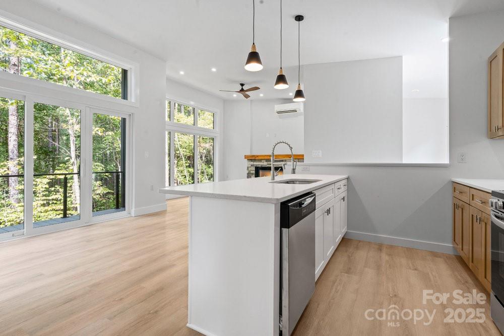203 Golden Crk Ridge Union Mills, NC 28167 - Photo 28 of 47 a kitchen with a sink window and cabinets