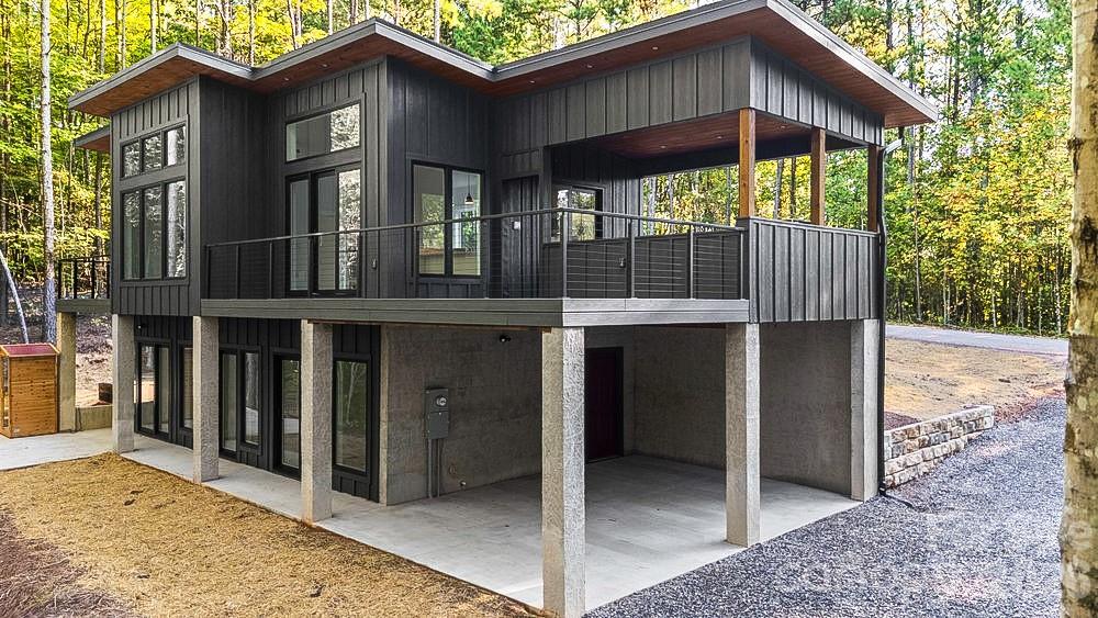 203 Golden Crk Ridge Union Mills, NC 28167 - Photo 3 of 47 a view of a house with a yard and porch