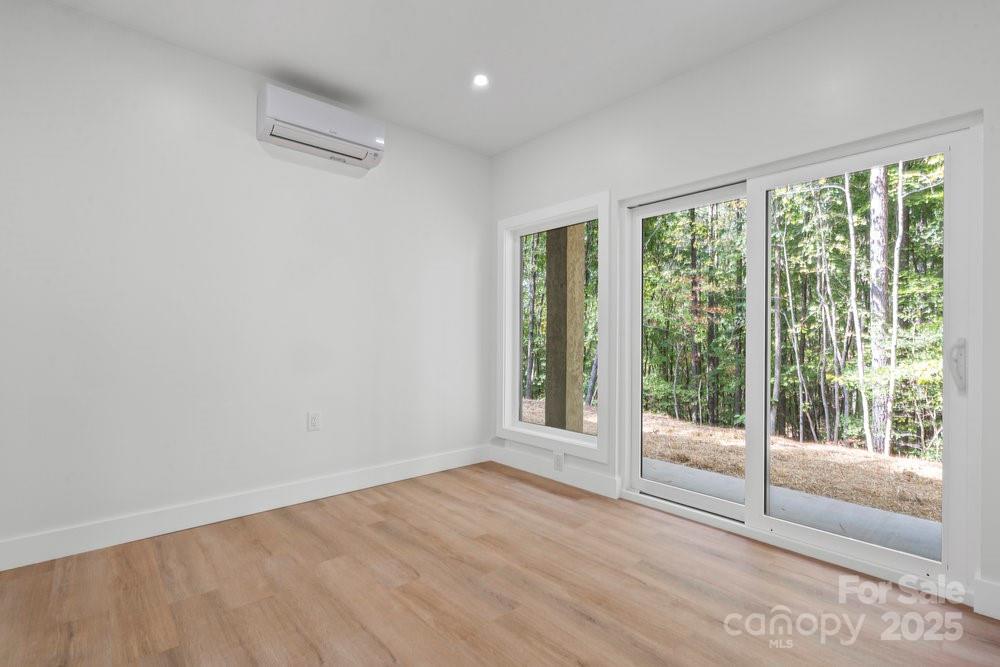 203 Golden Crk Ridge Union Mills, NC 28167 - Photo 38 of 47 a view of an empty room with wooden floor and a window