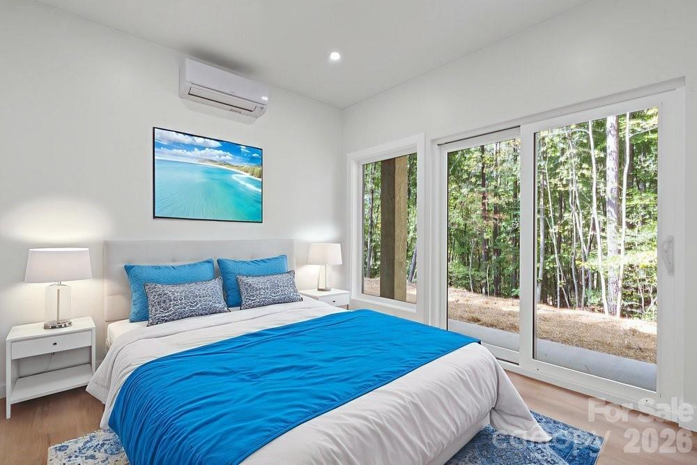 203 Golden Crk Ridge Union Mills, NC 28167 - Photo 39 of 47 a bedroom with bed and large window