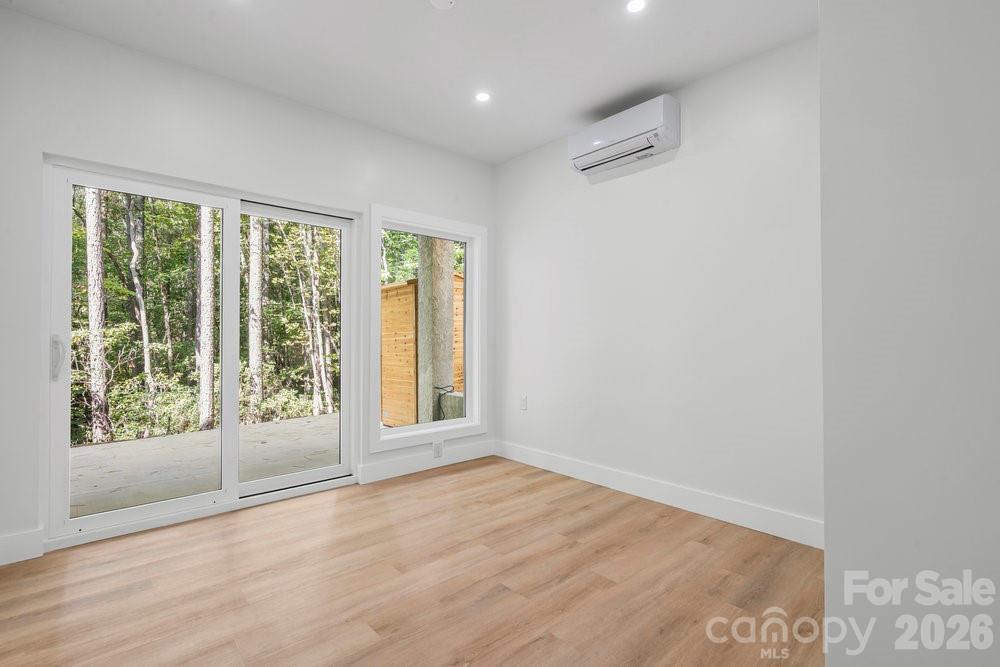 203 Golden Crk Ridge Union Mills, NC 28167 - Photo 40 of 47 a view of an empty room with wooden floor and a window