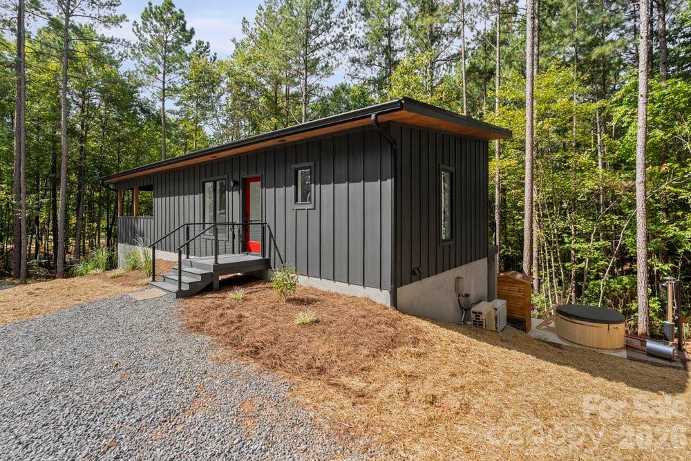 203 Golden Crk Ridge Union Mills, NC 28167 - Photo 4 of 47 a view of a house with backyard and trees