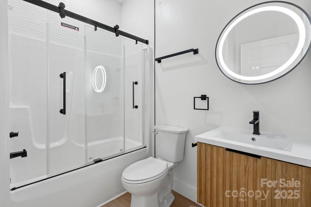 203 Golden Crk Ridge Union Mills, NC 28167 - Photo 42 of 47 a bathroom with a sink a toilet and a mirror