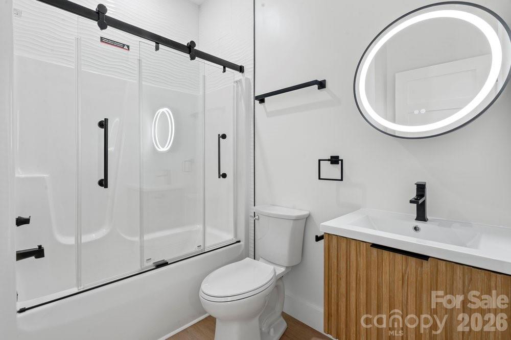 203 Golden Crk Ridge Union Mills, NC 28167 - Photo 42 of 47 a bathroom with a sink a toilet and a mirror