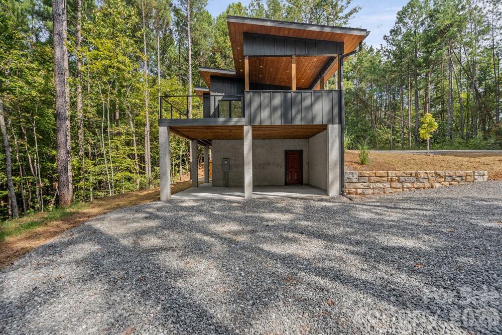203 Golden Crk Ridge Union Mills, NC 28167 - Photo 47 of 47 a view of a house with a tree and wooden fence