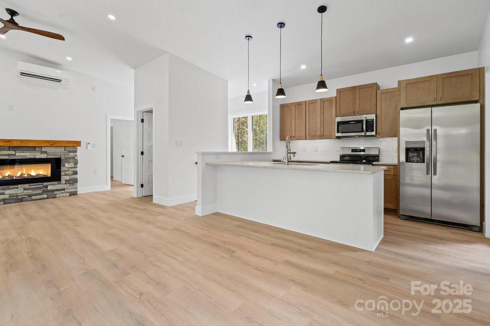 203 Golden Crk Ridge Union Mills, NC 28167 - Photo 9 of 47 a kitchen with stainless steel appliances granite countertop a refrigerator a oven a sink and a island