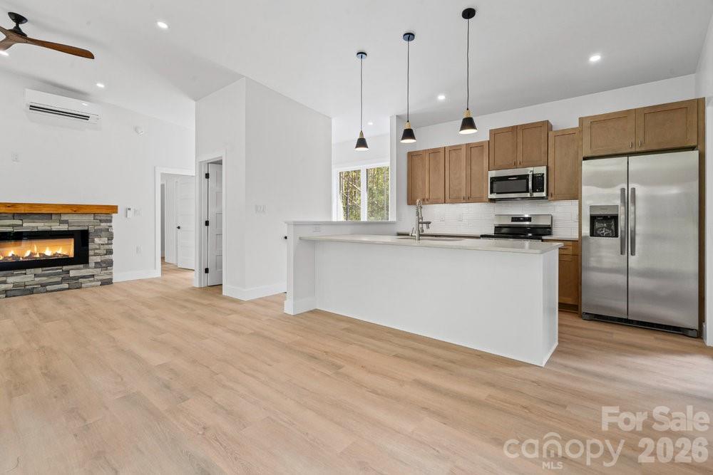 203 Golden Crk Ridge Union Mills, NC 28167 - Photo 9 of 47 a kitchen with stainless steel appliances granite countertop a refrigerator a oven a sink and a island