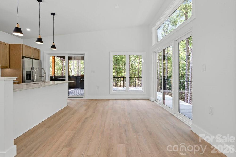 203 Golden Crk Ridge Union Mills, NC 28167 - Photo 10 of 47 a view of an empty room with a window and wooden floor