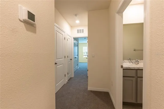 a view of a bathroom from the hallway