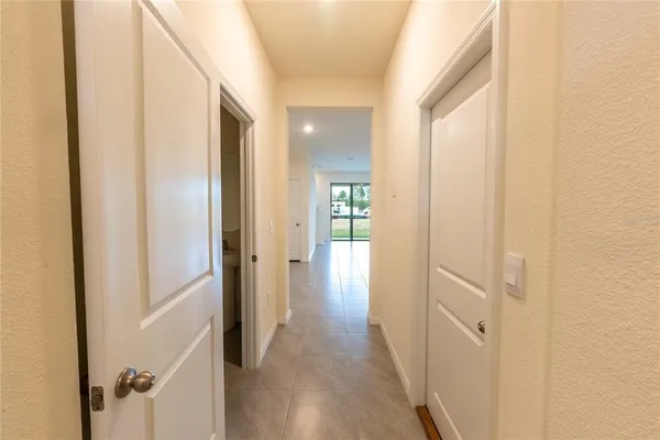 a view of a hallway with a wooden door