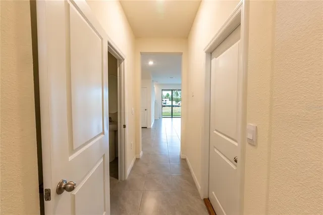 a view of a hallway with a wooden door