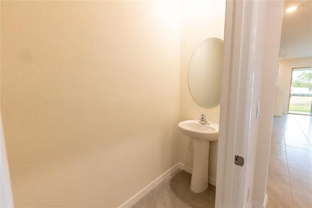 a bathroom with a sink and mirror