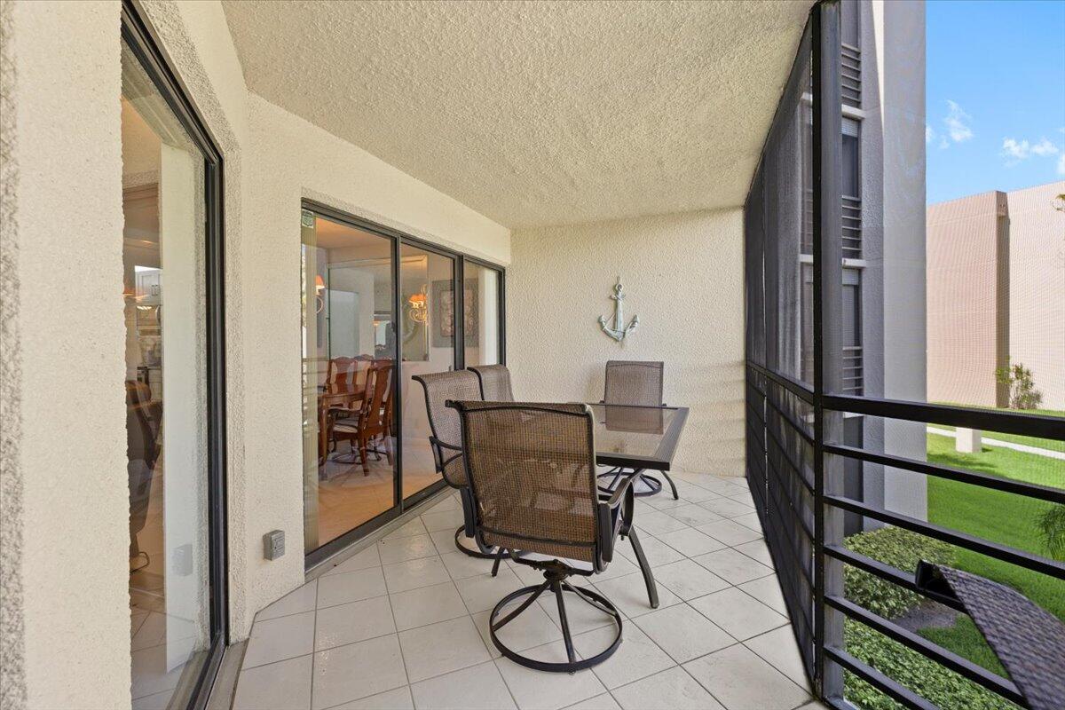 5851 Camino Del Sol, Unit 203 Boca Raton, FL 33433 - Photo 12 of 33 PATIO OVERLOOKING 1 OF 4 COMM. POOLS