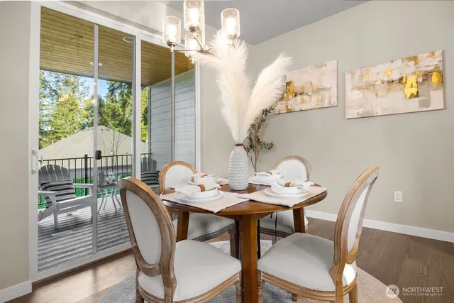a view of a dining room with furniture window and outside view