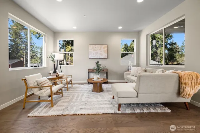 a living room with furniture and a large window
