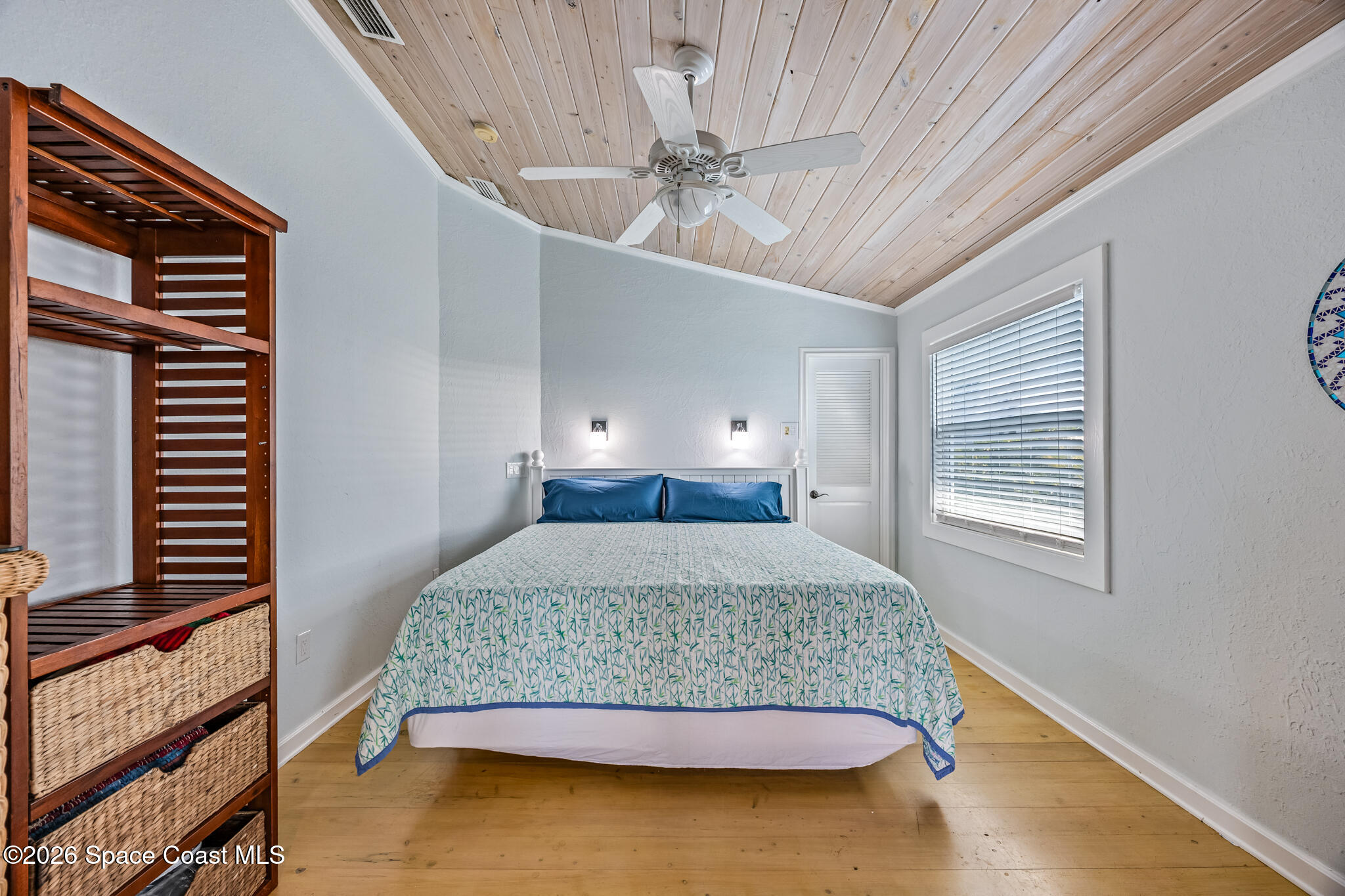 25 Vip Island, Unit A Grant, FL 32949 - Photo 14 of 56 a bedroom with a bed and window