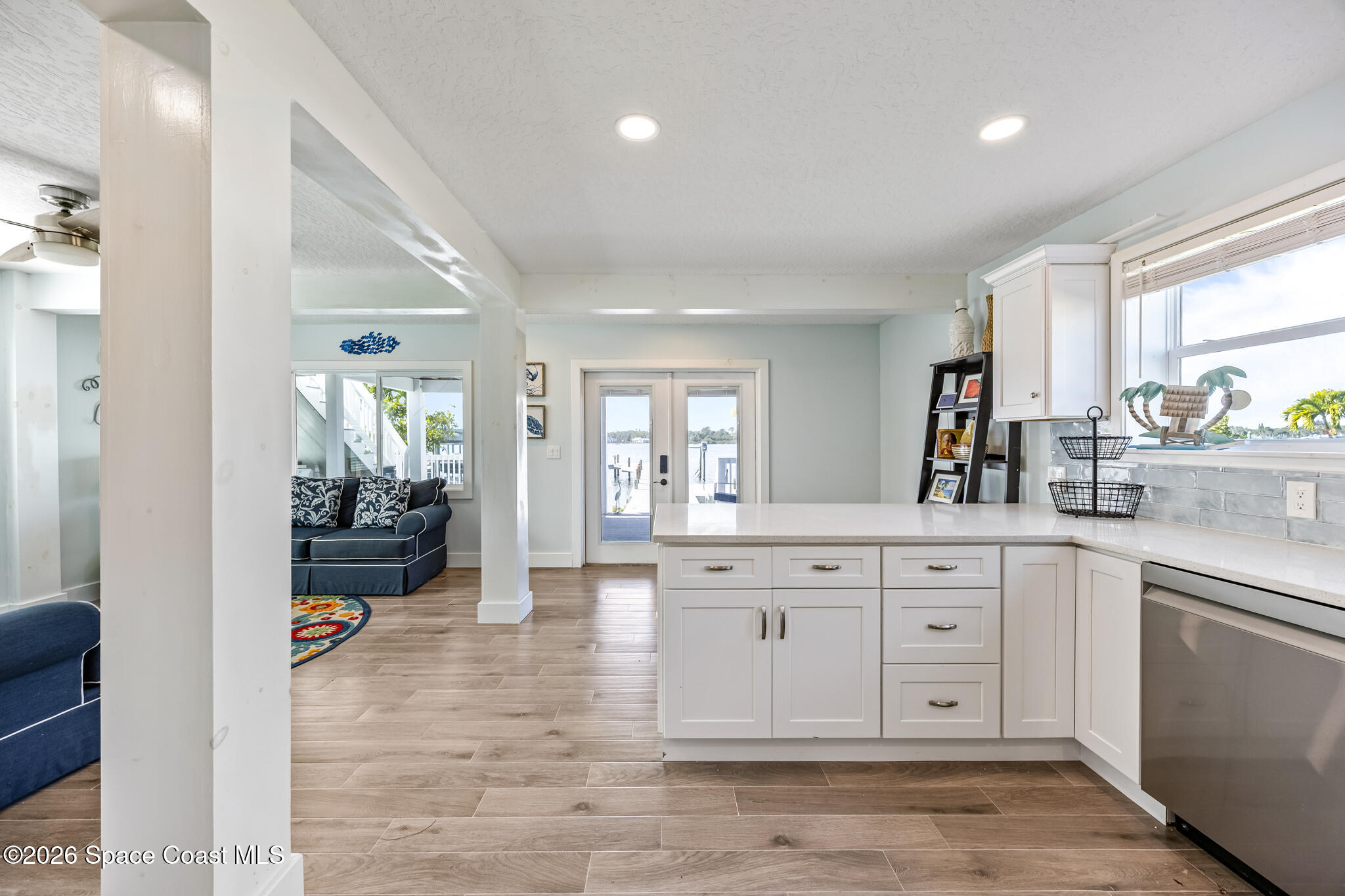 25 Vip Island, Unit A Grant, FL 32949 - Photo 20 of 56 a large bathroom with a large mirror vanity and shower