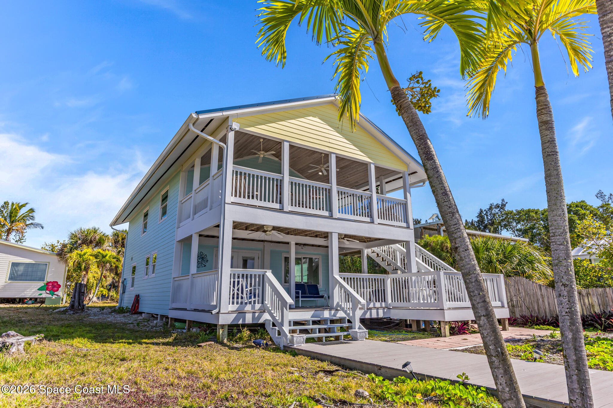 25 Vip Island, Unit A Grant, FL 32949 - Photo 39 of 56 a front view of a house with a yard