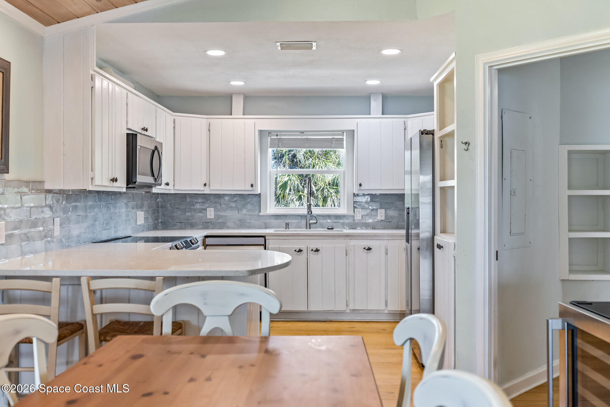 25 Vip Island, Unit A Grant, FL 32949 - Photo 7 of 56 a kitchen with stainless steel appliances granite countertop a refrigerator and a stove top oven