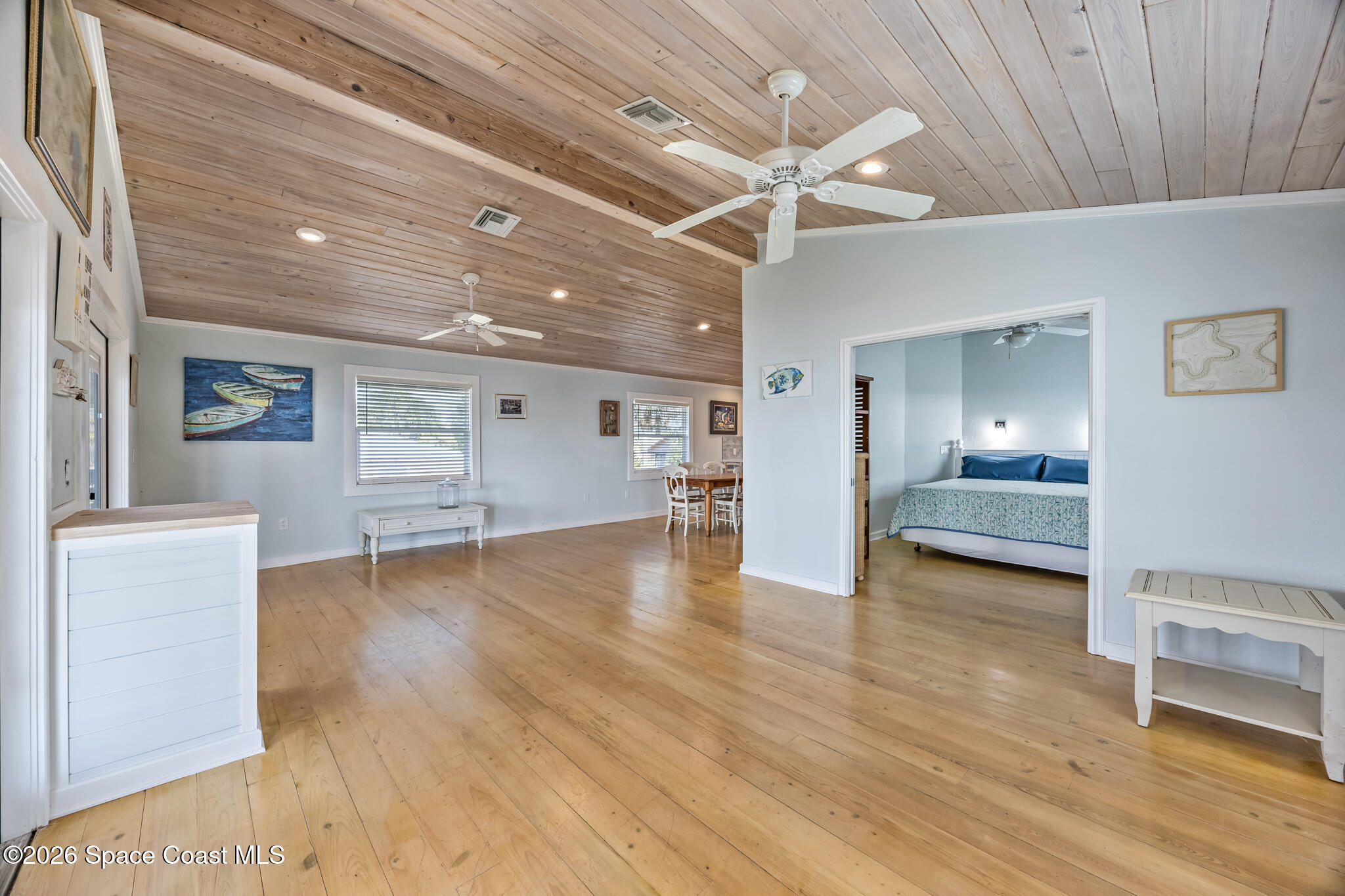 25 Vip Island, Unit A Grant, FL 32949 - Photo 9 of 56 a view of a livingroom with furniture and wooden floor