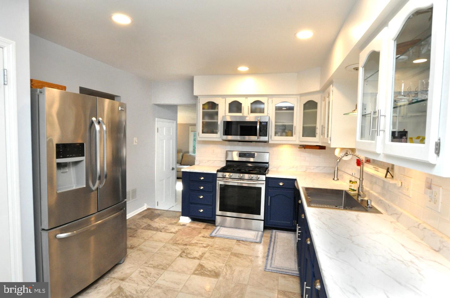 10 Blatherwick Drive Berlin, NJ 08009 - Photo 11 of 38 a large kitchen with stainless steel appliances granite countertop a refrigerator and a stove top oven