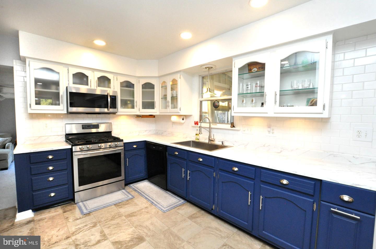 10 Blatherwick Drive Berlin, NJ 08009 - Photo 8 of 38 a kitchen with stainless steel appliances granite countertop a stove and cabinets
