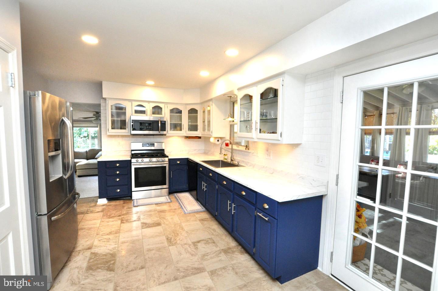 10 Blatherwick Drive Berlin, NJ 08009 - Photo 9 of 38 a kitchen with stainless steel appliances granite countertop a stove refrigerator and cabinets
