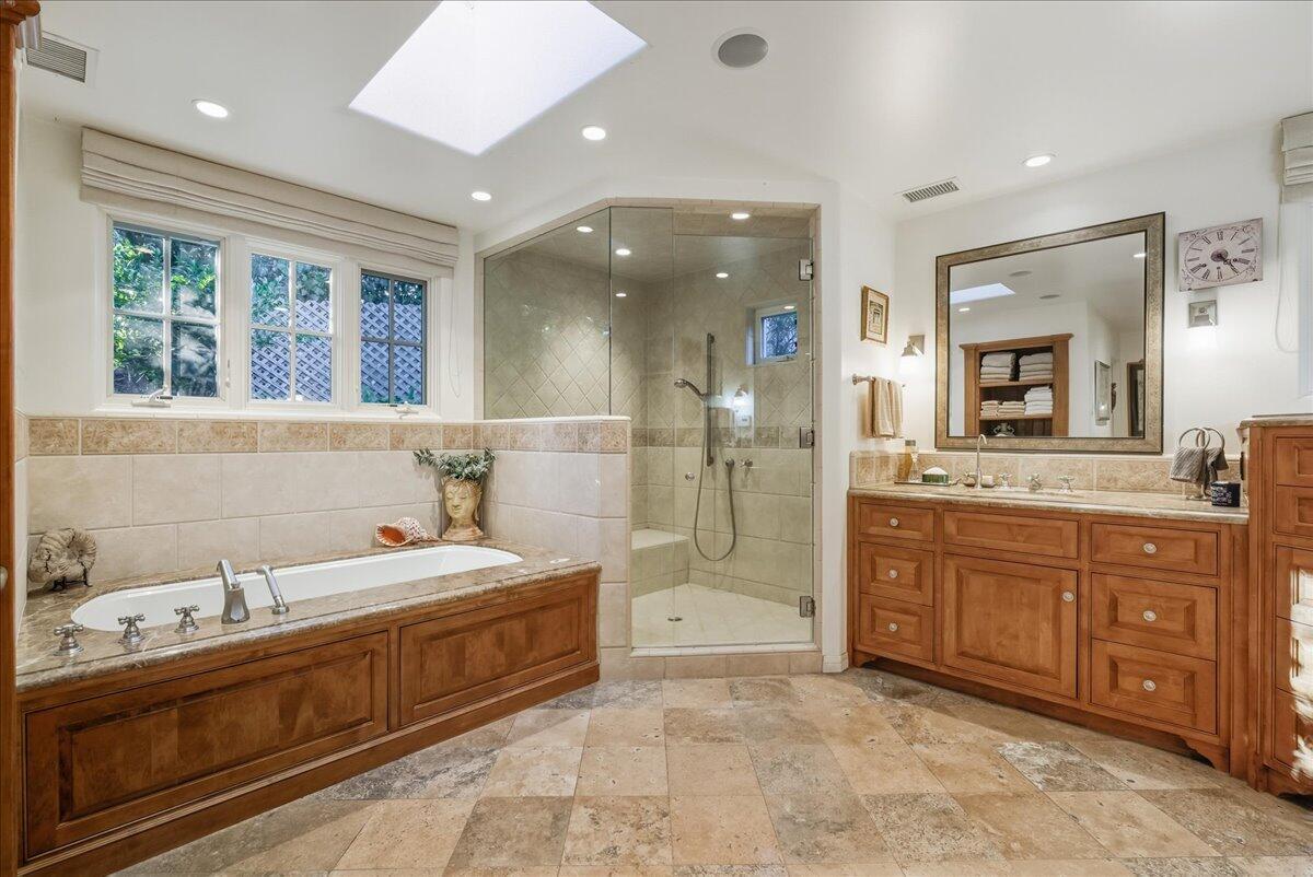 2140 Veloz Drive Montecito, CA 93108 - Photo 31 of 50 a spacious bathroom with a double vanity sink a mirror and a bathtub