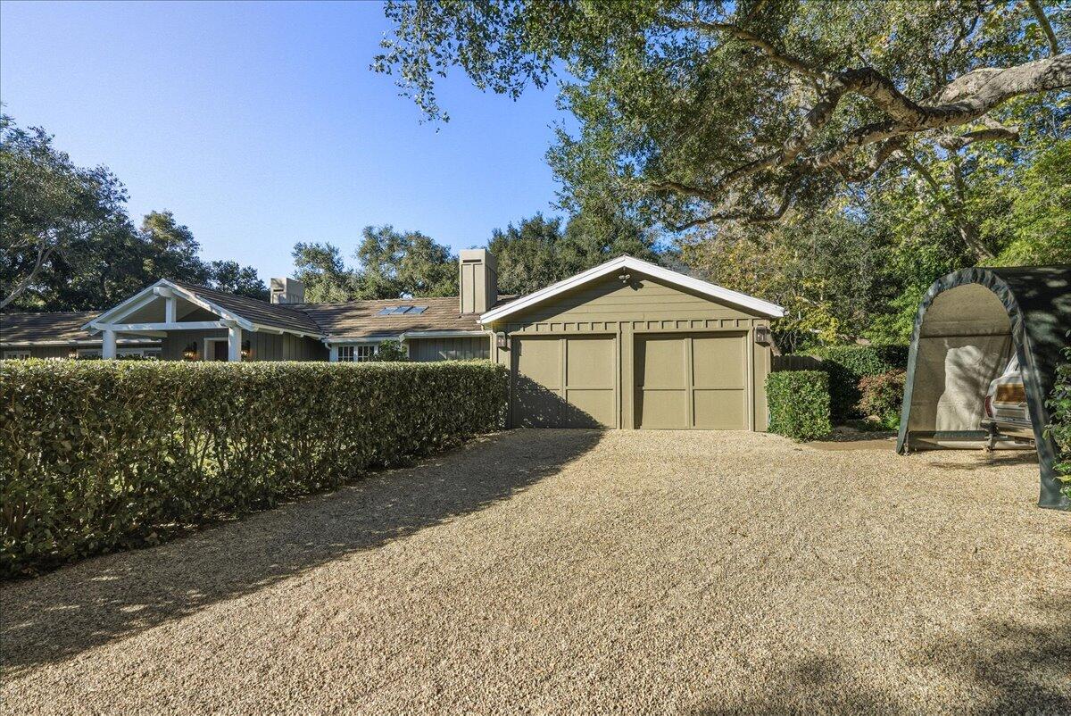 2140 Veloz Drive Montecito, CA 93108 - Photo 8 of 50 a front view of a house with a yard and garage