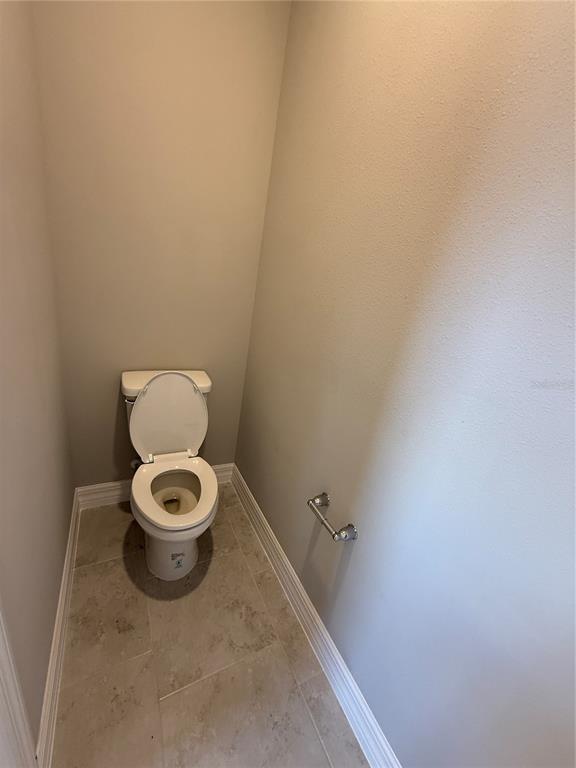 2268 Brewster Road North Port, FL 34288 - Photo 18 of 33 a white toilet sitting in a bathroom