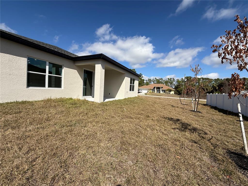 2268 Brewster Road North Port, FL 34288 - Photo 30 of 33 a view of a house with a yard