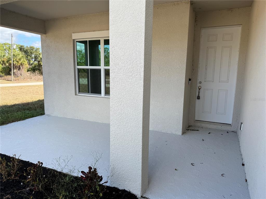 2268 Brewster Road North Port, FL 34288 - Photo 3 of 33 a view of an empty room with a window