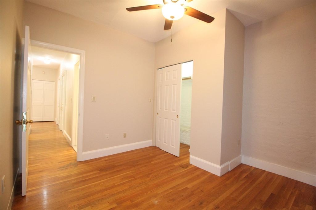 11 Worcester Street, Unit 2 Boston, MA 02118 - Photo 13 of 23 a view of an empty room with wooden floor