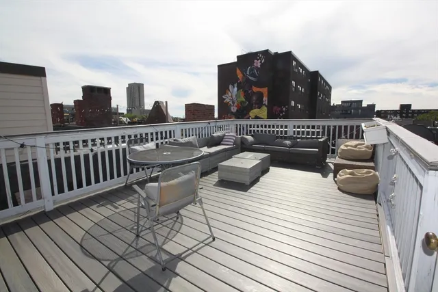 a view of roof deck with patio