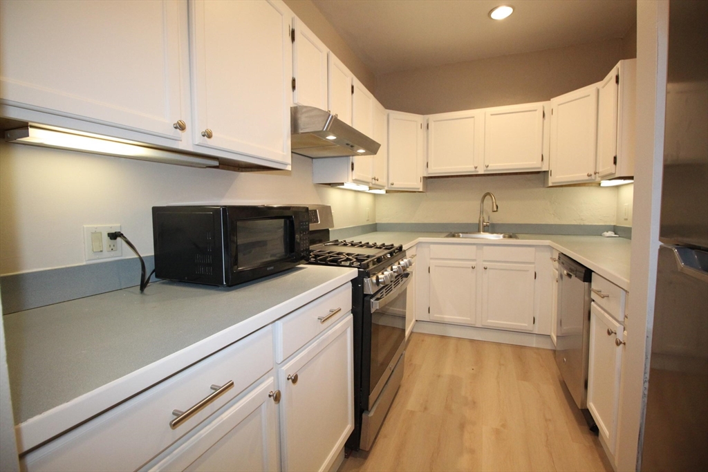 11 Worcester Street, Unit 2 Boston, MA 02118 - Photo 4 of 23 a kitchen with a sink and cabinets