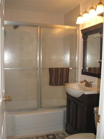 39 Griffin Street Springfield, MA 01104 - Photo 12 of 20 a bathroom with a sink and a mirror